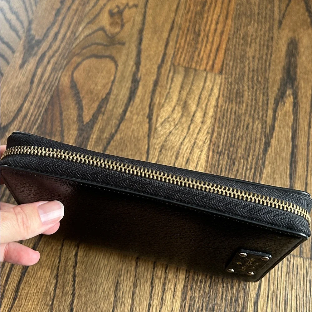 Black leather Kate Spade Wellesley zip around personal organizer/planner